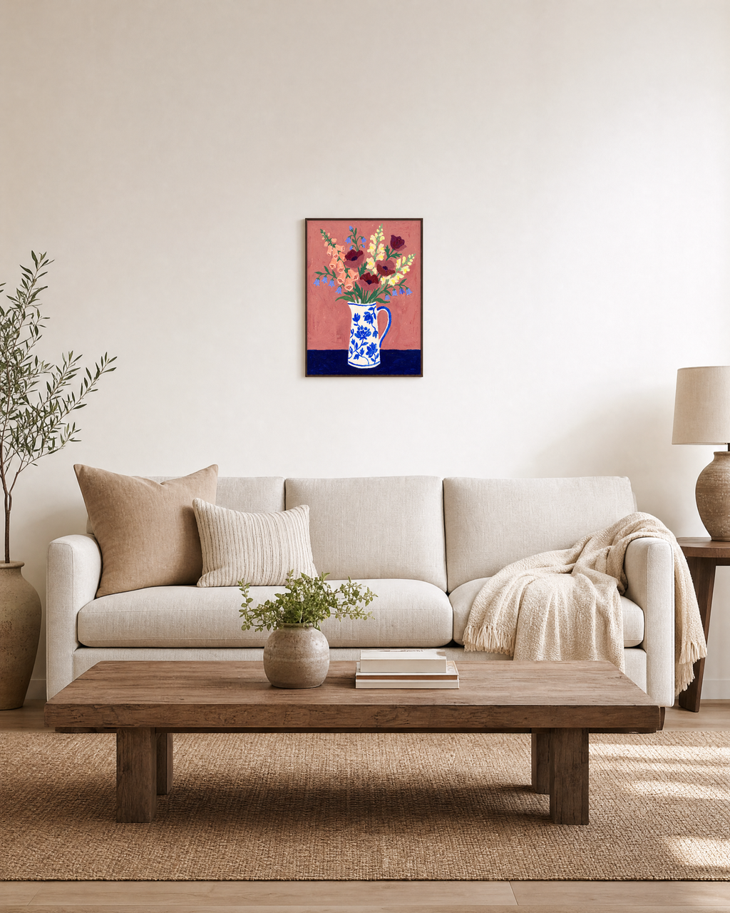 Pink Table Blooms floral wall art styled above a living room sofa