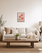 Rose Count coral rose wall art: unframed print is shown framed for styling in a living room; frame not included