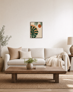 Monstera Cut Across Two Suns unframed print is shown framed for styling in a living room; frame not included