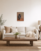 Black Amphora Motif unframed print is shown framed for styling in a living room; frame not included