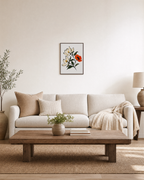Two Magnolias One Rust Poppy unframed print is shown framed for styling in a living room; frame not included