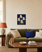 Cream Irises On Navy Field unframed print is shown framed for styling in a living room; frame not included