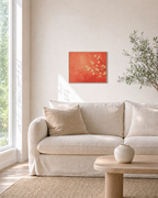 Plum Blossoms From Right unframed print is shown framed for styling in a living room; frame not included