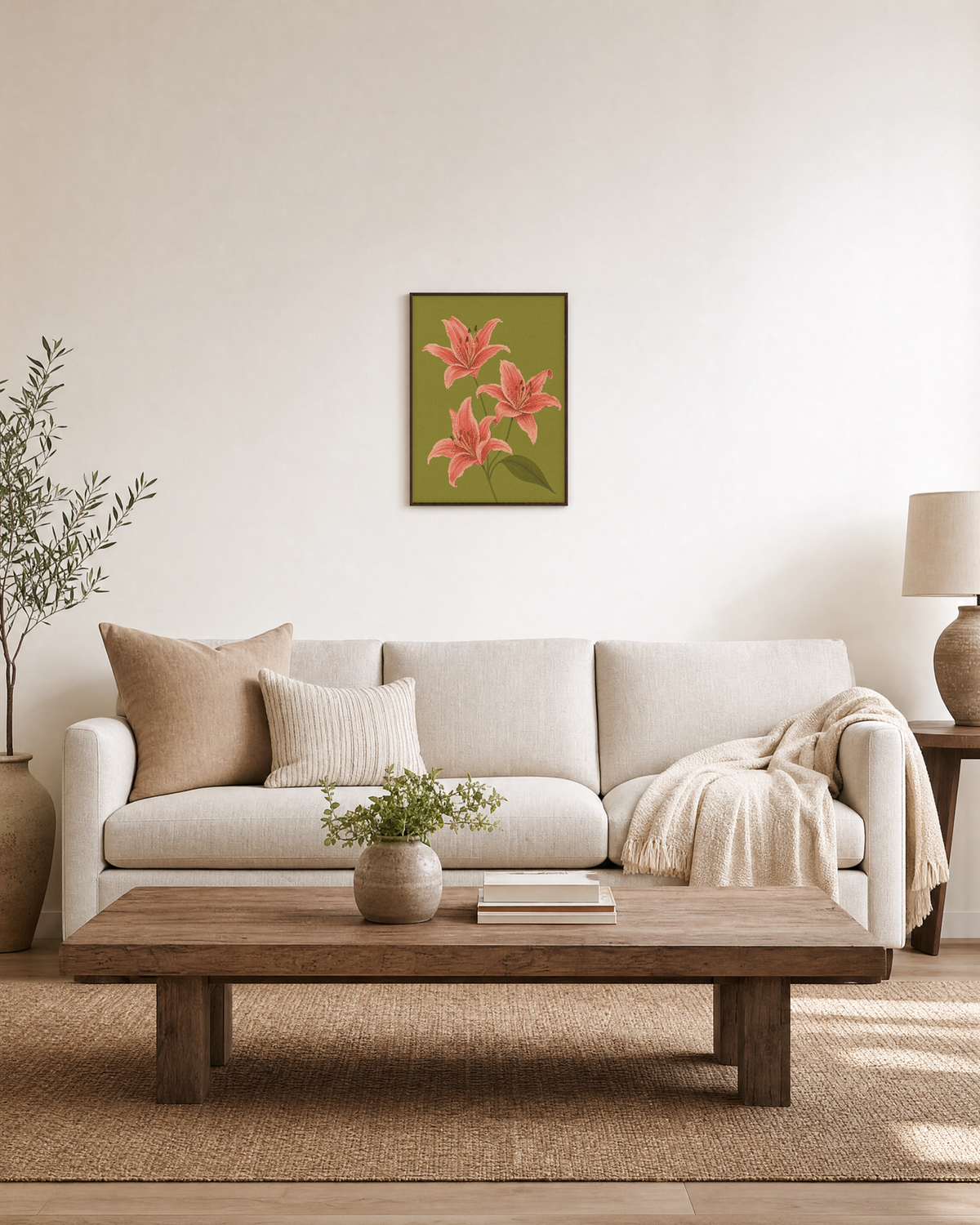 Three Coral Spotted Lilies One Olive Leaf Blade unframed print is shown framed for styling in a living room; frame not included