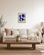One Rest cobalt shape wall art: unframed print is shown framed for styling in a living room; frame not included