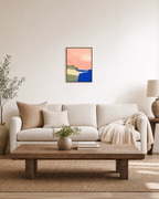Blue Cliff Pink unframed print is shown framed for styling in a living room; frame not included