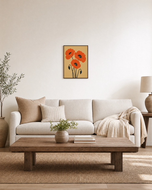 Bud Hooks three orange poppies wall art: unframed print is shown framed for styling in a living room; frame not included
