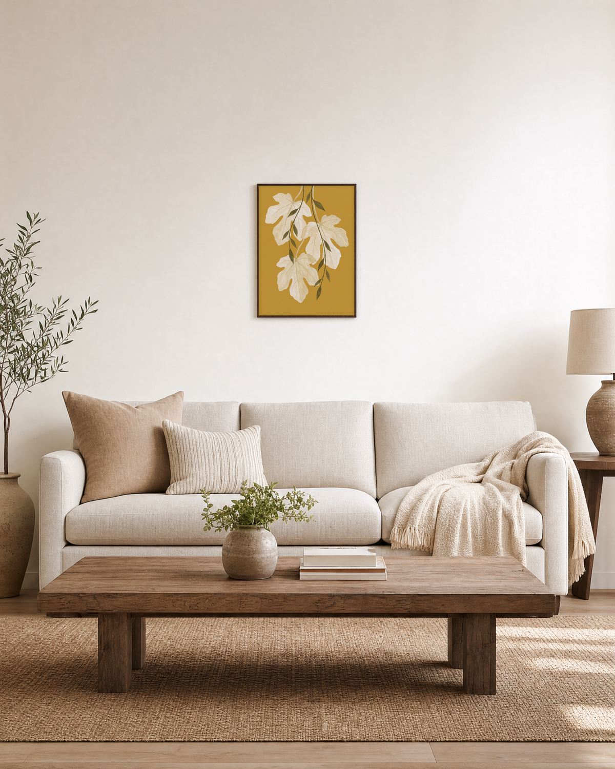Sheer Fig Leaves Mustard unframed print is shown framed for styling in a living room; frame not included