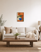 First Pull orange espresso wall art: unframed print is shown framed for styling in a living room; frame not included