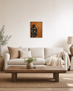 Black Amphora Motif unframed print is shown framed for styling in a living room; frame not included