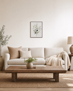 Three Olive Sprigs Two Figs unframed print is shown framed for styling in a living room; frame not included