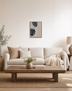 Dark Leaves over Striped Pot striped vase botanical wall art print: unframed print is shown framed for styling in a living room; frame not included