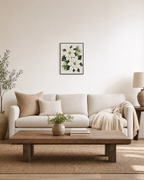 Winter Bloom white poinsettia print: unframed print is shown framed for styling in a living room; frame not included