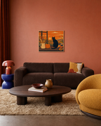 Black Cat Autumn Window unframed print is shown framed for styling in an ochre living room; frame not included
