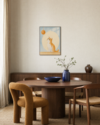 Orange Cat Yarn Drop unframed print is shown framed for styling in a dining room; frame not included