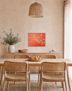 Plum Blossoms From Right unframed print is shown framed for styling in a dining room; frame not included