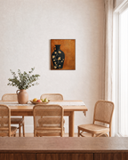 Black Amphora Motif unframed print is shown framed for styling in a dining room; frame not included