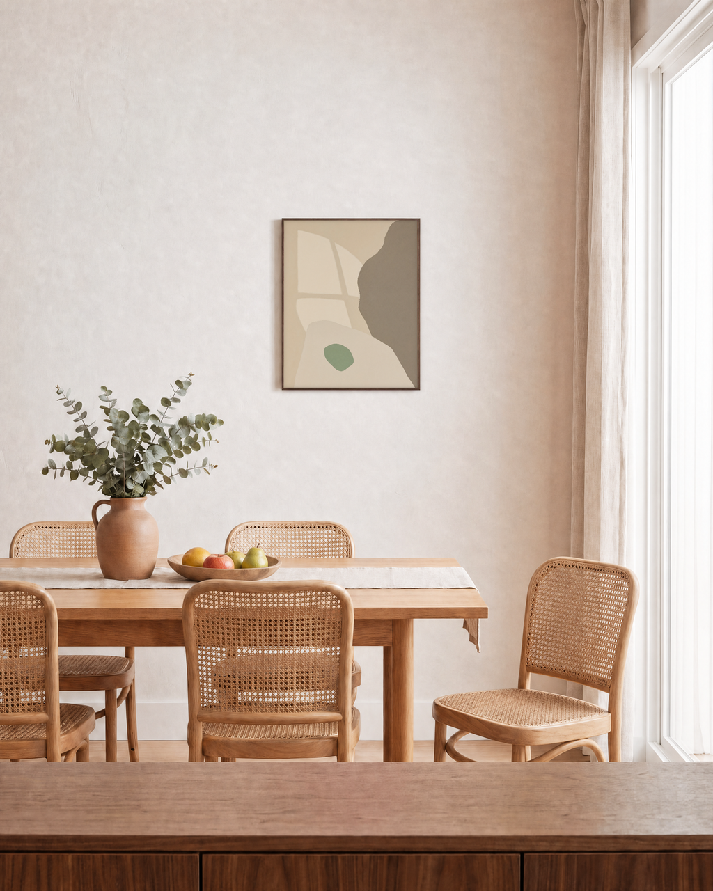 Pale Peach Against Sage pale peach and sage shapes wall art print: unframed print is shown framed for styling in a dining room; frame not included