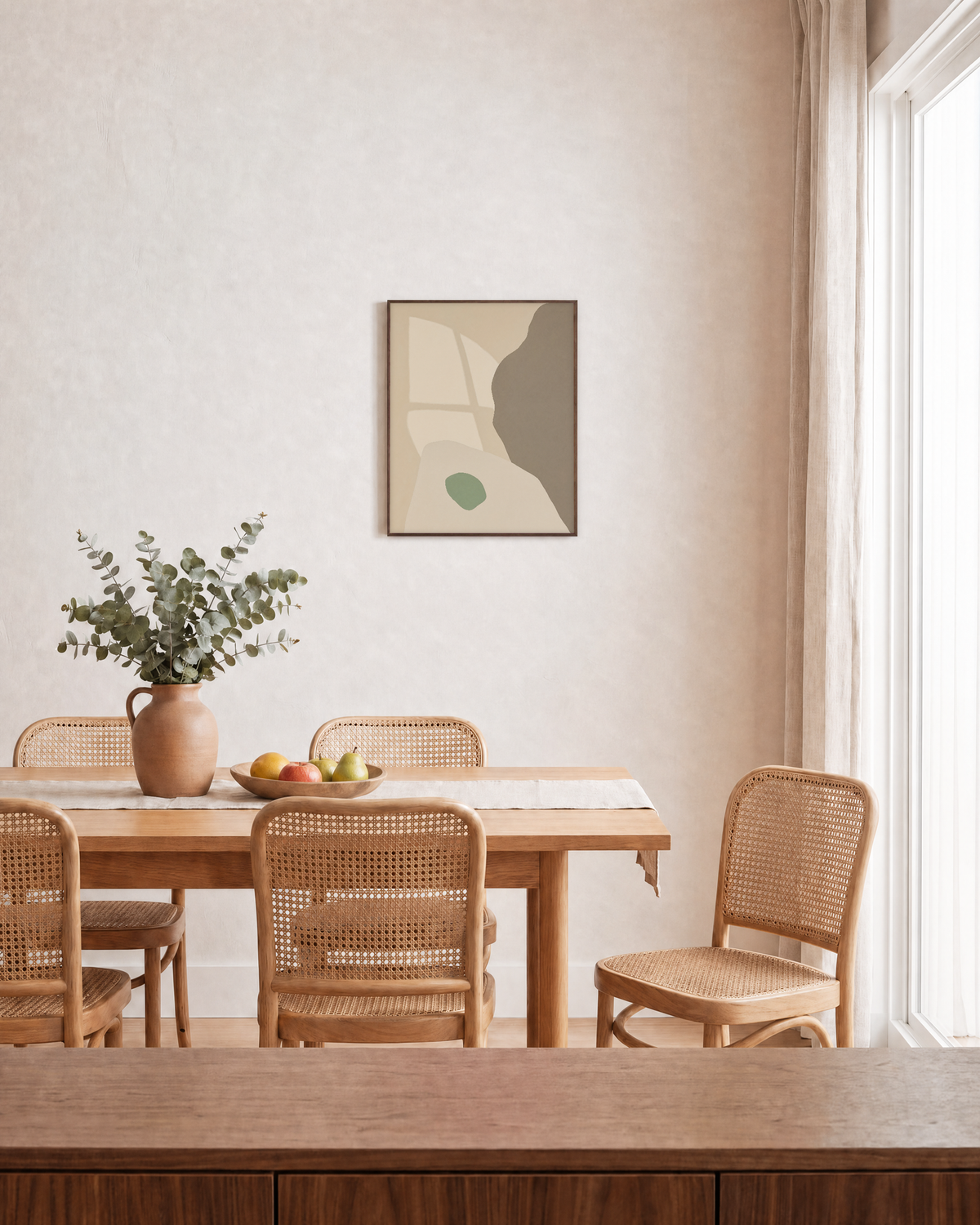 Pale Peach Against Sage pale peach and sage shapes wall art print: unframed print is shown framed for styling in a dining room; frame not included