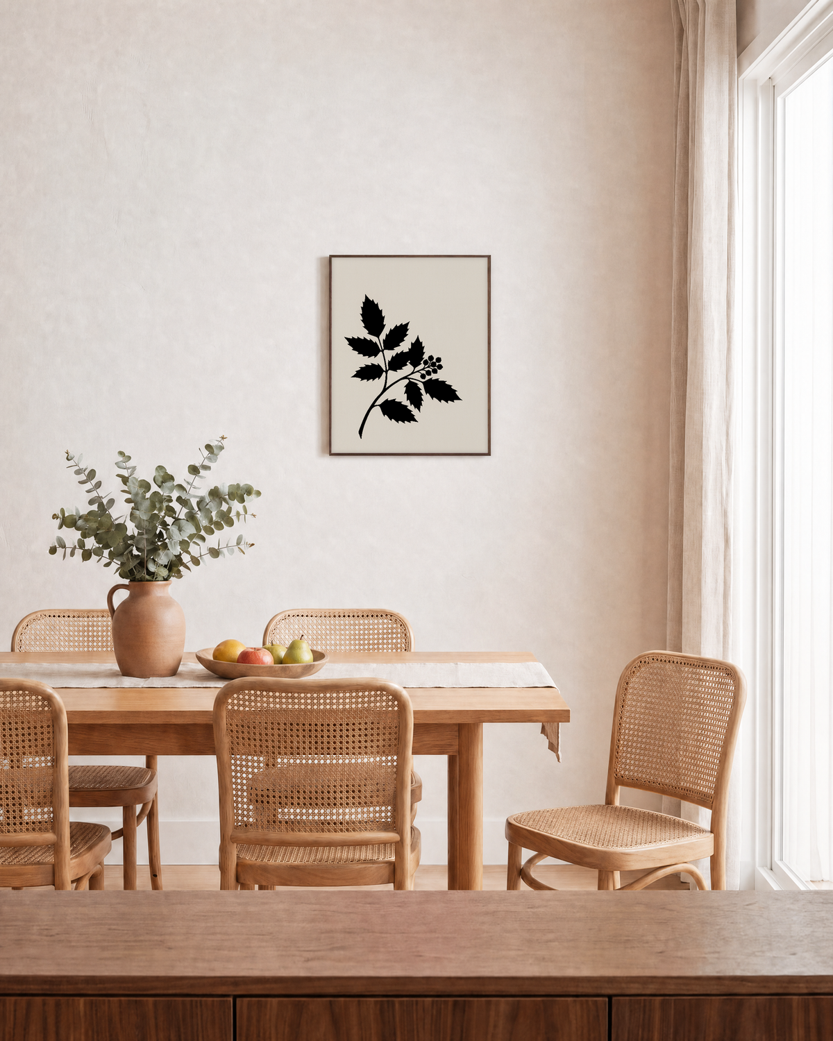 Single Plant Silhouette black leaf wall art: unframed print is shown framed for styling in a dining room; frame not included
