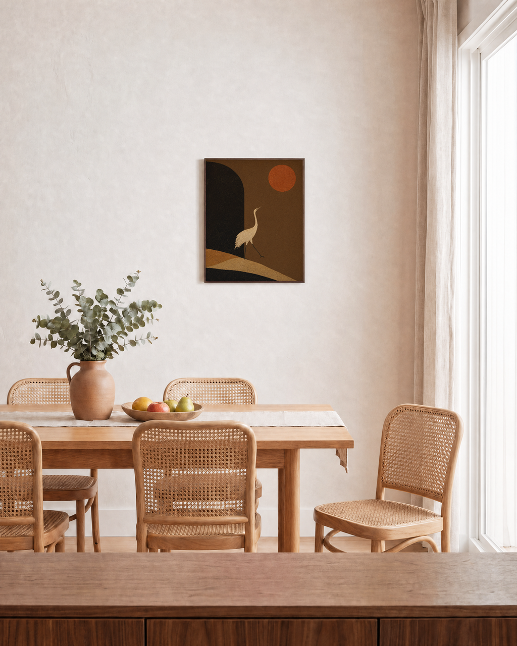 Crane Over Umber Arch unframed print is shown framed for styling in a dining room; frame not included