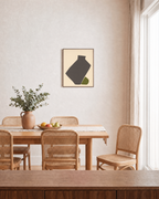 Olive Vessel unframed print is shown framed for styling in a dining room; frame not included