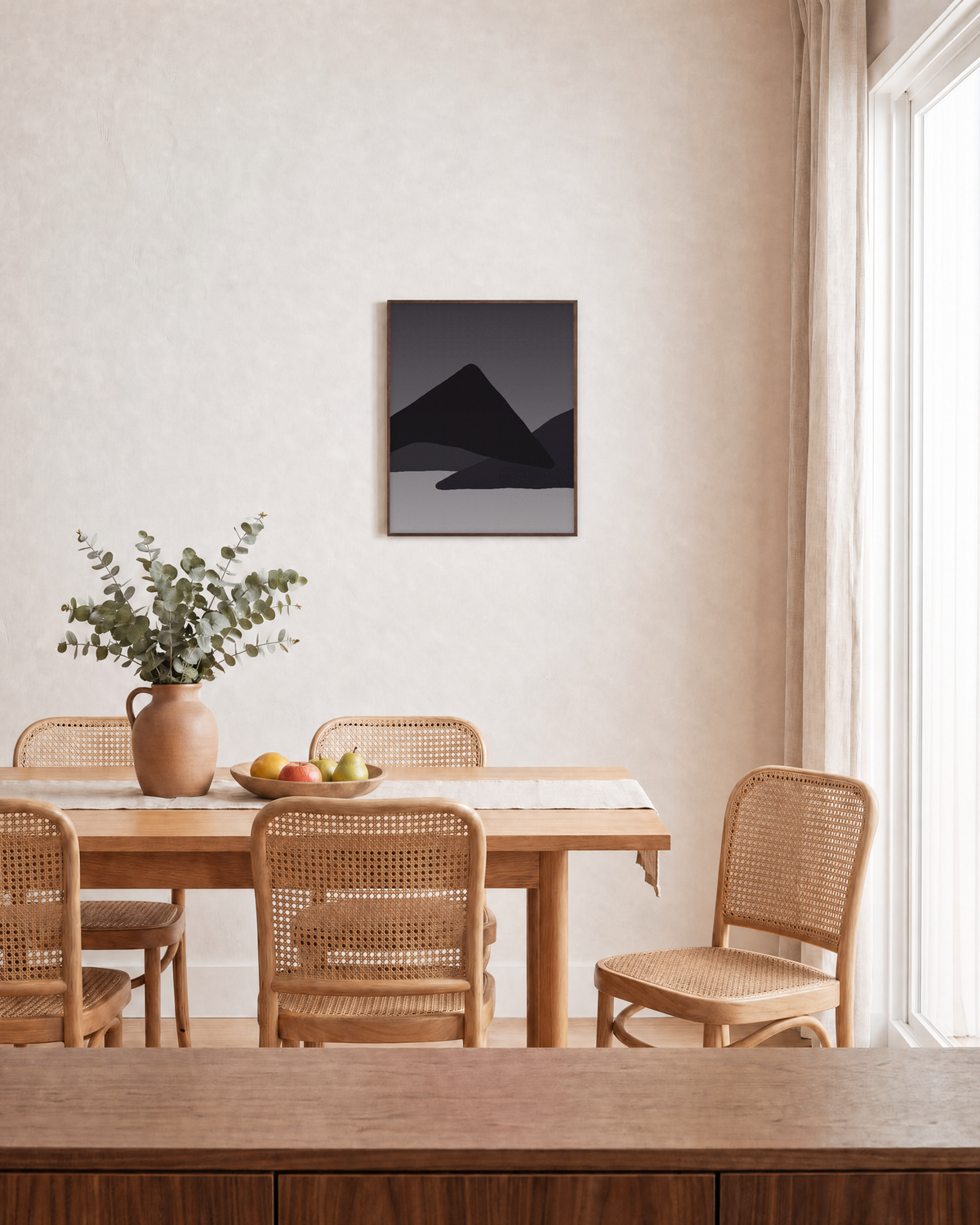 Layered Black Mountain Ridges black geometric wall art: unframed print is shown framed for styling in a dining room; frame not included