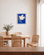 Dove Branch Blue unframed print is shown framed for styling in a dining room; frame not included