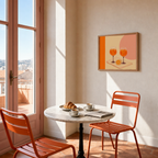 Spritz Pair spritz glass wall art: unframed print is shown framed for styling in a balcony door breakfast nook; frame not included