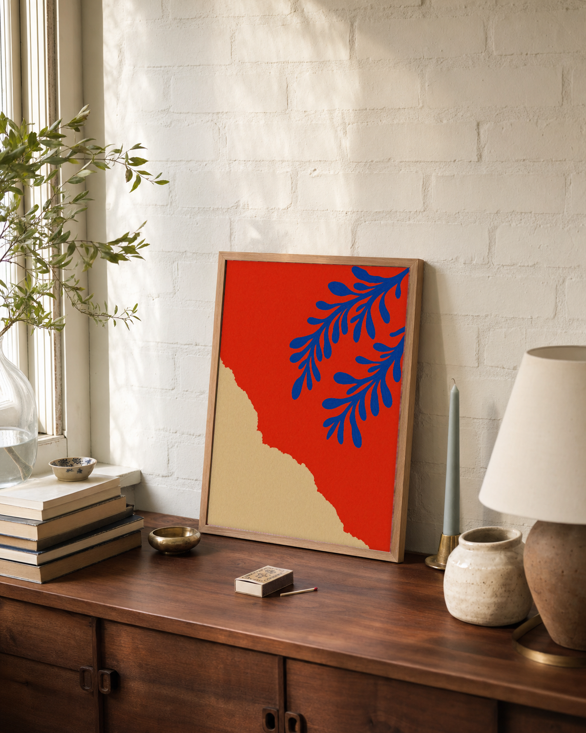 Two Coral Sprigs Blue unframed print is shown framed for styling in a dining console; frame not included