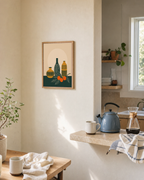 Twin Orange Sprigs Vertical unframed print is shown framed for styling in a kitchen pass-through; frame not included