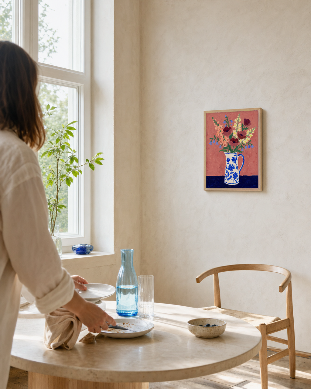 Cobalt Vase with Mixed Blooms terracotta floral wall art print: unframed print is shown framed for styling in a window side dining corner; frame not included