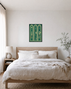 Three Launches teal rocket arch print: unframed print is shown framed for styling in a bedroom; frame not included