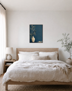 Teal Willow Pitcher unframed print is shown framed for styling in a bedroom; frame not included