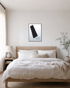 Pure Form unframed print is shown framed for styling in a bedroom; frame not included