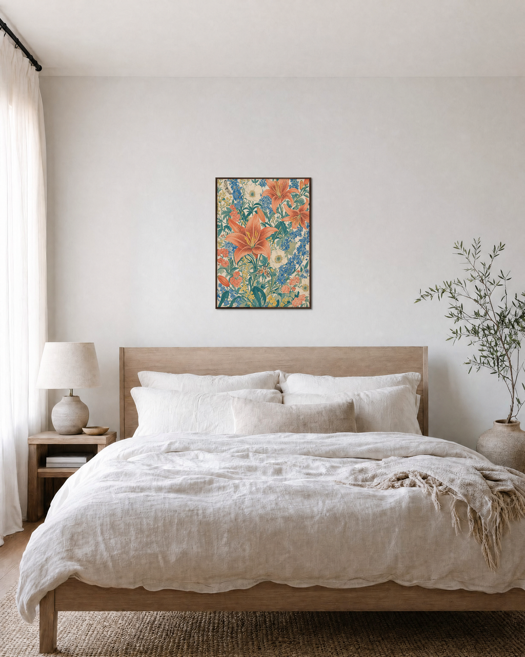 Wild Spray coral lily meadow wall art: unframed print is shown framed for styling in a bedroom; frame not included