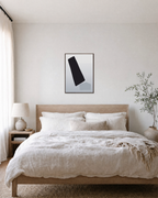 Offset Forms on White white geometric wall art: unframed print is shown framed for styling in a bedroom; frame not included