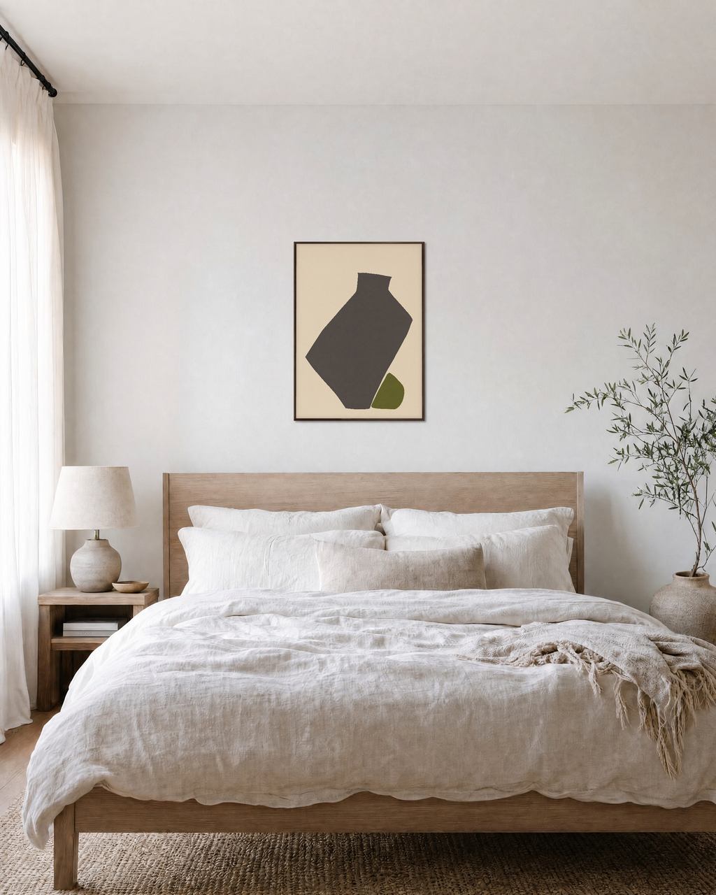 Olive Tilt olive green abstract vase wall art print: unframed print is shown framed for styling in a bedroom; frame not included
