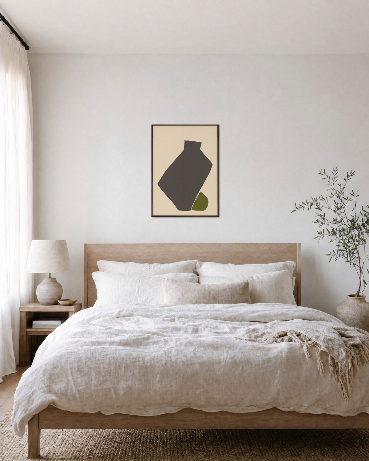Olive Tilt olive green abstract vase wall art print: unframed print is shown framed for styling in a bedroom; frame not included