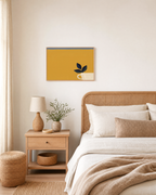 Mustard Leaf Pot Studio edition unframed print is shown framed for styling in a bedroom; Frame not included