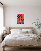 Coral Signal navy and orange wall art: unframed print is shown framed for styling in a bedroom; frame not included