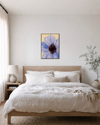One Poppy Dark Eye unframed print is shown framed for styling in a bedroom; frame not included