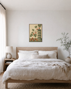 Fig Stripe Cylinder unframed print is shown framed for styling in a bedroom; frame not included