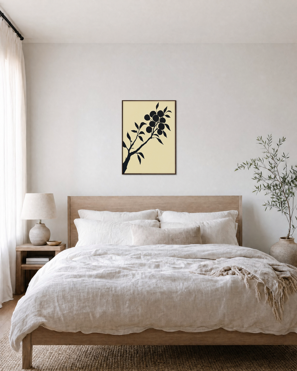 Diagonal Fruiting Branch fruiting branch silhouette wall art print: unframed print is shown framed for styling in a bedroom; frame not included