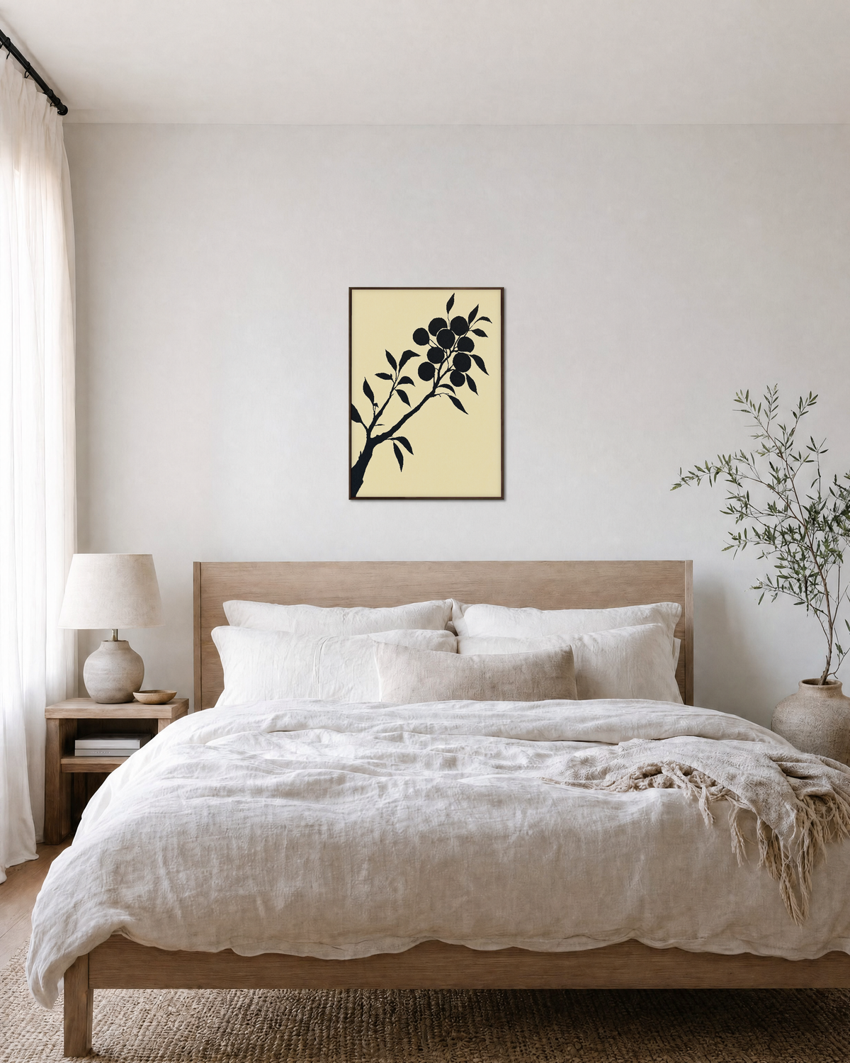 Diagonal Fruiting Branch fruiting branch silhouette wall art print: unframed print is shown framed for styling in a bedroom; frame not included