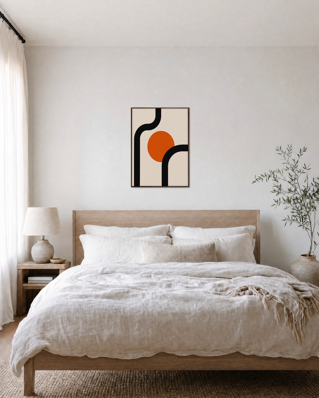Orange Pause orange disk wall art: unframed print is shown framed for styling in a bedroom; frame not included