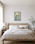 Ivory Pitcher Blooms Studio edition unframed print is shown framed for styling in a bedroom; Frame not included