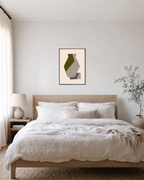 Olive Vessel unframed print is shown framed for styling in a bedroom; frame not included