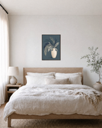 Teal Willow Pitcher unframed print is shown framed for styling in a bedroom; frame not included