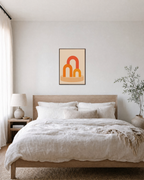 Three Warm Arches One Pedestal unframed print is shown framed for styling in a bedroom; frame not included